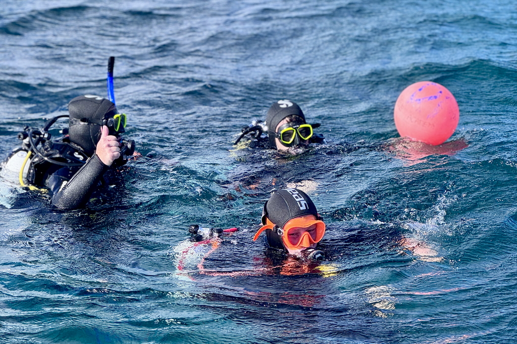 group of divers practicing rescue skills in the Atlantic waters in Inishmore, Aran Islands