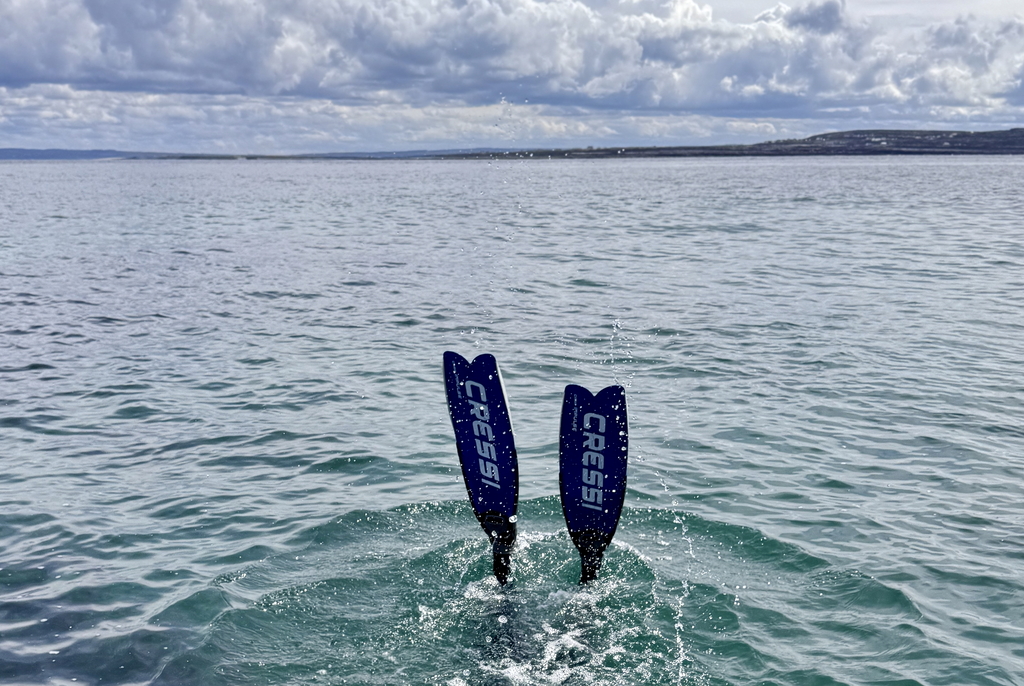 Freediver descends in clear Atlantic waters inishmore,  Aran Island
