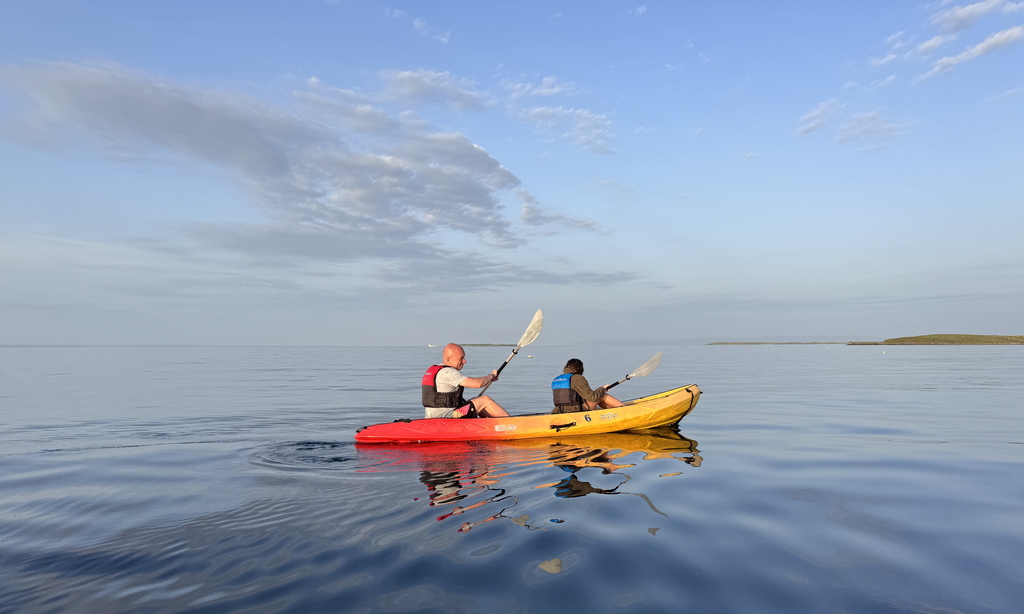 sunset on a kayak exploring killeany bay Inishmore, Aran Islands